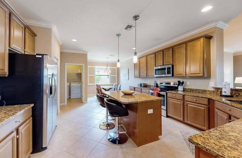 Estero House | Spacious home with enclosed lanai, WiFi, AC, WD, pool, tennis court, & gym