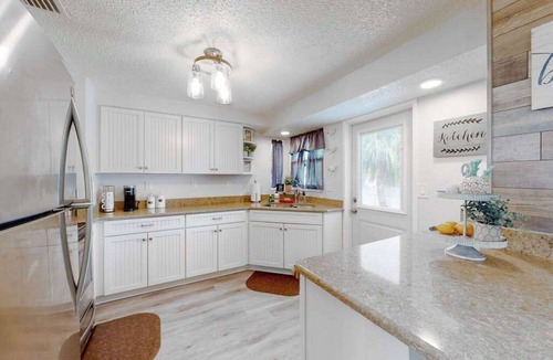 Cortez House | Sunny canal front home with a pool & dock - central location and dogs ok
