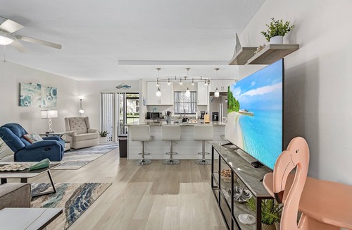 Cypress Lake Condo | This farmhouse modern condo at The Club at Crystal Lake is perfectly located — minutes from Fort Myers Beach, Sanibel & Captiva Islands, 30 day min