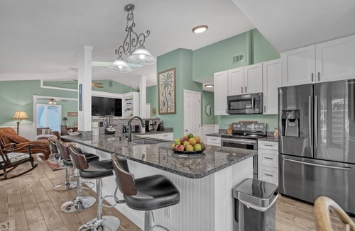 Sebastian Highlands House | Tropical Oasis on double lot w/Pool, Pond, King Bed & Mosaics- Pet Friendly!