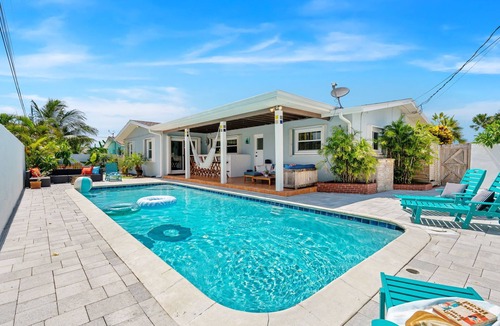 Seacoast Shores House | Tropical Retreat: Indian Harbour Beach Home with BBQ Grill, Fire Pit, Private Pool & Hot Tub! 🌴