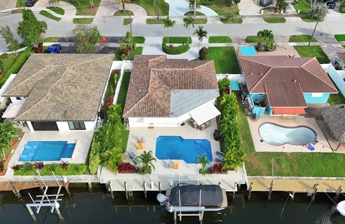 Garden Isles House | Tropical vacation retreat! Waterfront and Heated pool!