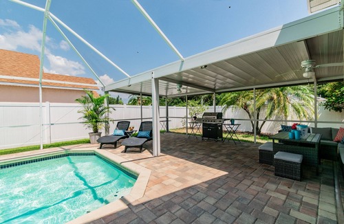 Bearss Plaza House | "Vacation Getaway: Heated private POOL, Outdoor Living, Game Room & Boat Rental"