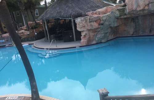 Ono Island Condo | Vacation Paradise at Purple Parrot Resort Relax at the Tiki Bar New on
