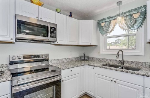 Myrtle Grove House | Very Private Home w/HEATED Pool, Palm Trees and Big Fenced Yard.