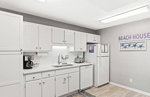 West Panama City Beach Condo | Walk to Beach 2BR Sleeps 7 Pool + Beach Gear