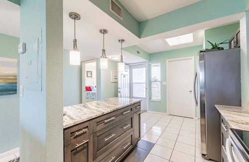 Isla del Sol Condo | Waterfront 2BR/2BA condo with pool, hot tub, balcony, and beach access.