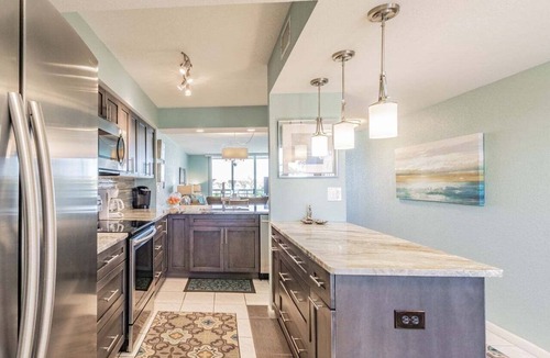 Isla del Sol Condo | Waterfront 2BR/2BA condo with pool, hot tub, balcony, and beach access.