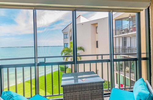 Isla del Sol Condo | Waterfront 2BR/2BA condo with pool, hot tub, balcony, and water views.