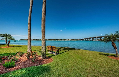 Isla del Sol Condo | Waterfront 2BR condo with pool, hot tub, balcony, and water views.