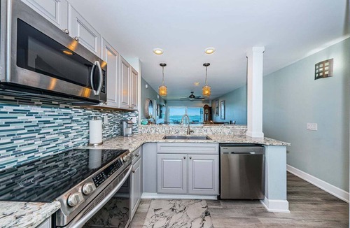 Casa del Mar Villa | Waterfront 2BR condo in St. Petersburg with balcony, pool, and hot tub.