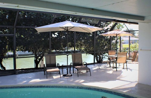 Marco Island House | Waterfront 3BR retreat with heated pool, WiFi, and marina access.