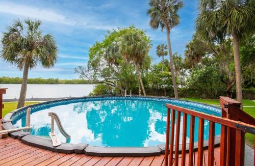 Riverview Villa | Waterfront 6BR Oasis, Pool, Gym, Huge Dock