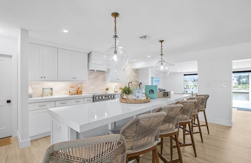 South Island House | Waterfront Beach-Style Retreat with Pool, Dock & Game Room in Fort Myers