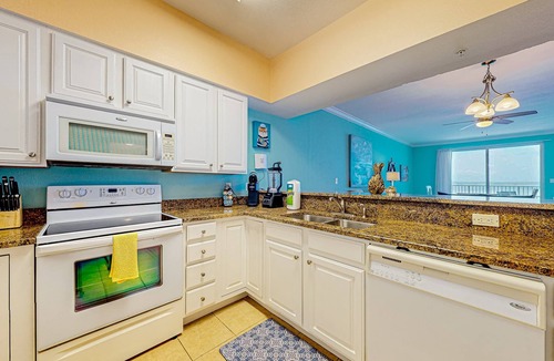 Ono Island Condo | Waterfront condo with beach access, pools, balcony, central AC, & W&D