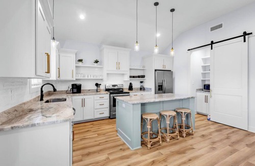 Shoreline Park House | Waterfront Escape in Bay STL with dock,pickleball, ping pong, basketball & more!