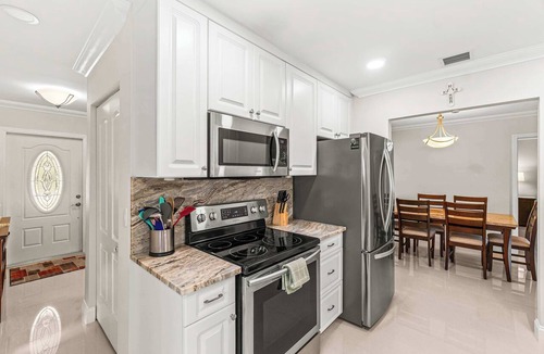 Tropic Palms Villa | Waterfront Home: Poolcuzzi, Kayaks, Pool Table