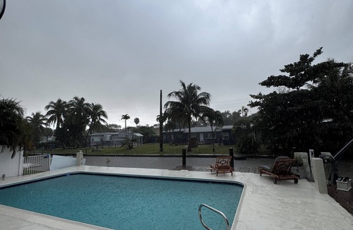 Croissant Park House | Waterfront retreat with private dock, pool & jacuzzi close to downtown & beach.