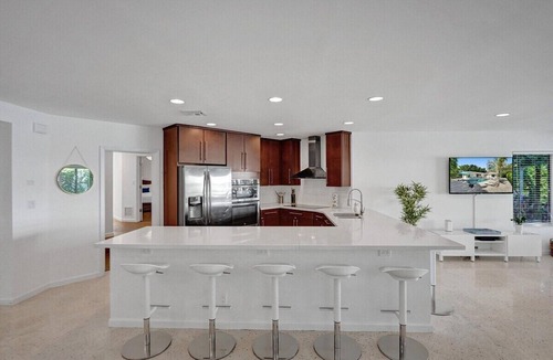 Dolphin Isles House | Welcome to your own private oasis at this enchanting Fort Lauderdale retreat!