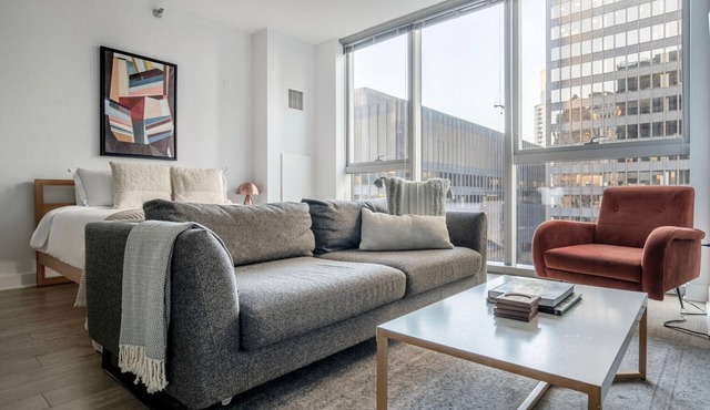 Airy Loop Studio w/Theater & Games, nr Millennium Park, by Blueground in Chicago