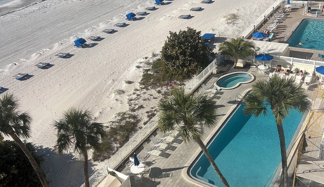Beachfront condo w/large balcony perfect for dolphin and sunset watching.
