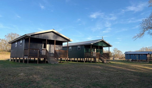 Cozy 1-bedroom cabin in serene Foxworth with AC. Sleeps 16