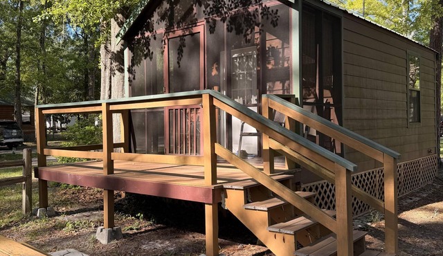 Deluxe Cabin - The Bear Den - Our Deluxe Cabins offer comfort with a true Okefenokee feel. Climate controlled, private, and set in a quiet part of the campground.