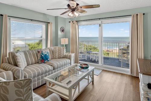 Direct oceanfront 2/2 corner condo with large balcony, heated pool, and garage parking in Ormond Beach