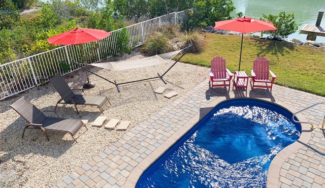 Escape To Marathon in Large 4BR 3BA Canal Front Home Sleep 10 with Heated Pool