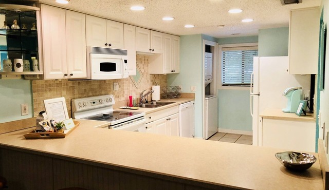 Greatest location! Condo with private yard!