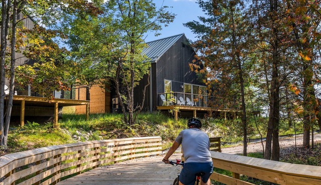 KOTI 12 (Three Bedroom) Traverse City's Scandinavian Cabins, vacation home on TART & mins to Travers. in Williamsburg
