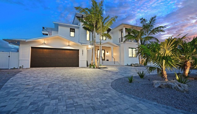 Luxe Waterfront Canal Home w Heated Pool & Spa Rooftop Deck Outdoor Kitchen Golf