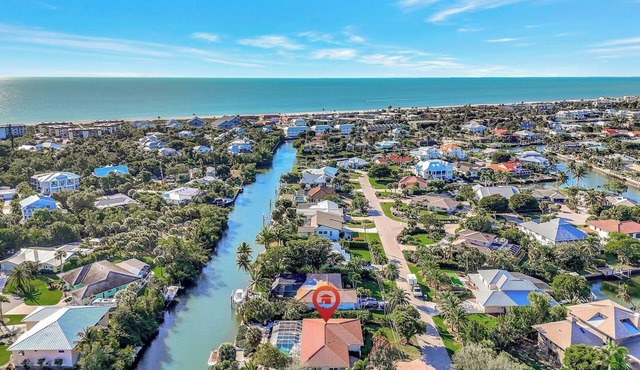 Manatee Cove - Gorgeous Canal Front Home with Heated Pool and Deeded Beach Access!