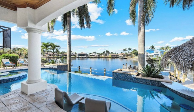 Paradise Palms Retreat - 5 BR (Sleeps 13) All New - Pool, Dock, Theatre + Games