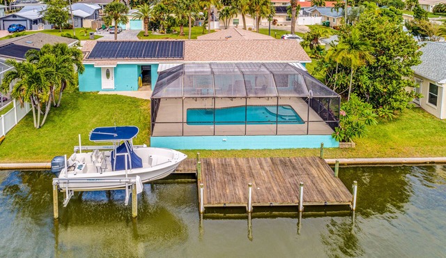 Riverfront home with private heated pool, dock, AC & W/D - dog-friendly