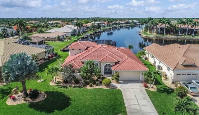 Sailboat-Access Waterfront Retreat with Sunset Pool Living in Punta Gorda