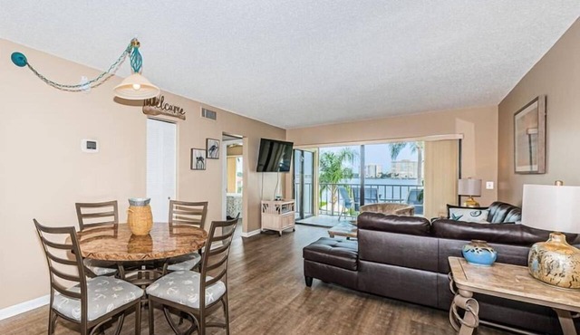 Waterfront 2BR/2BA condo with pool, hot tub, balcony, and Wi-Fi.