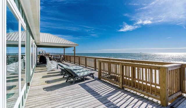 Waterfront home with wraparound deck, BBQ, spacious interior, & W/D in Dauphin Island