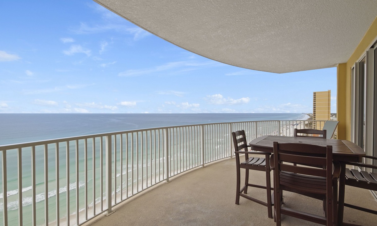 West Panama City Beach Condo | Emerald Isle 1401 - Front row beach chair service included! Affordable rates!