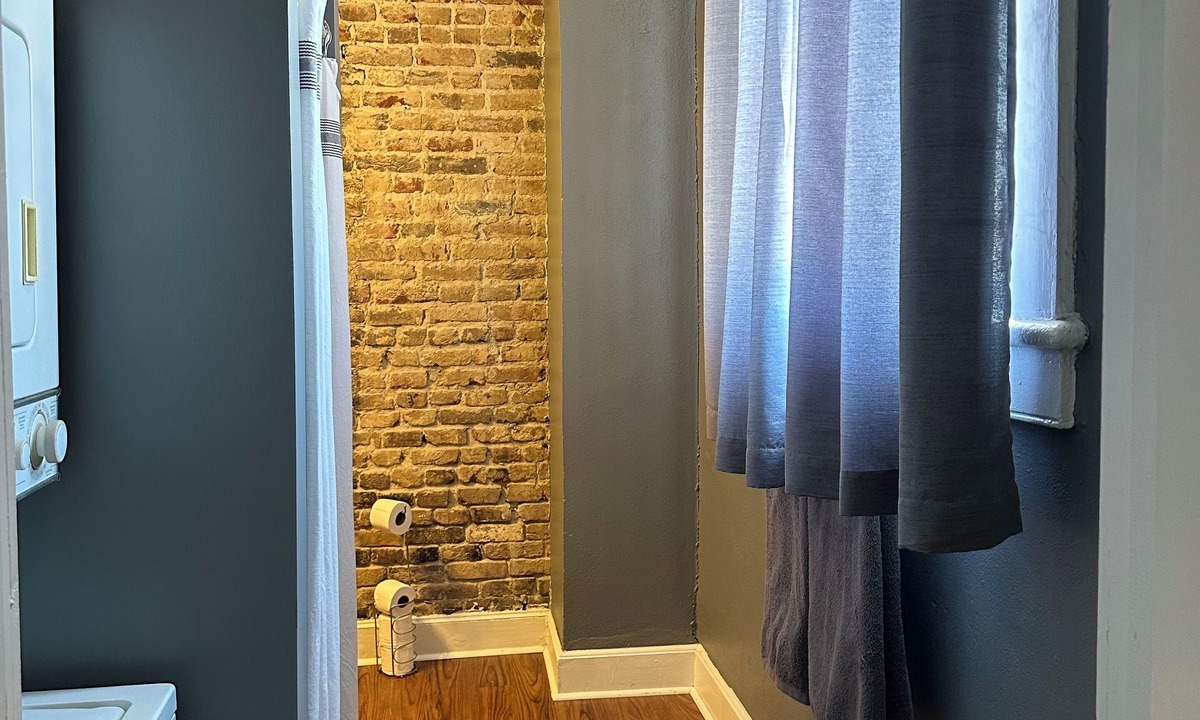 Central Business District Apartment | Historic 1800s Dauphin Street Loft - Above Iconic 109-Year-Old Candy Shop