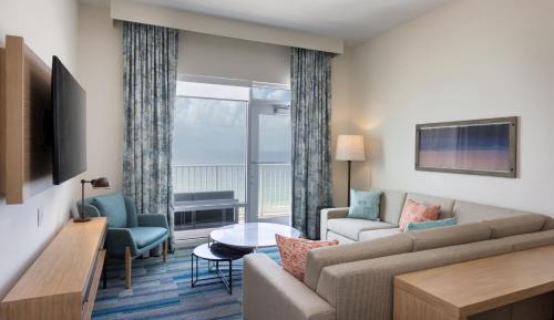 One-Bedroom Suite with One King Bed, One Set of Bunk Beds, Beach View, Balcony and Sofa Bed