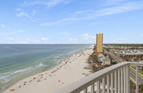 West Panama City Beach Condo | Emerald Isle 1401 - Front row beach chair service included! Affordable rates!