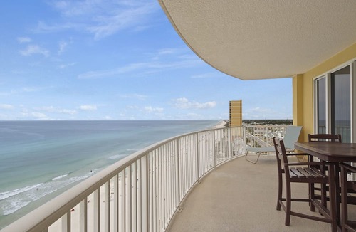 West Panama City Beach Condo | Emerald Isle 1401 - Front row beach chair service included! Affordable rates!
