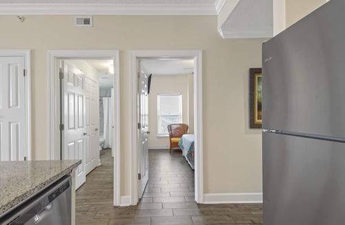 West Panama City Beach Condo | Emerald Isle 1401 - Front row beach chair service included! Affordable rates!