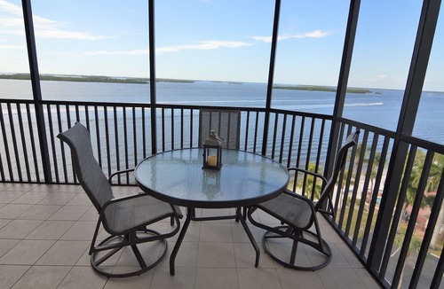 Punta Rassa Condo | Sanibel Harbour Resort Bay View Tower 837: Unwind & recharge in the wrap-around lanai.