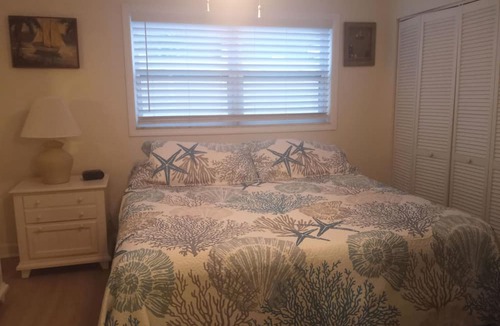 Sunset Beach Condo | Treasure Island Waterfront Condo, Equipped Fishing dock, Steps to Beach, Dining