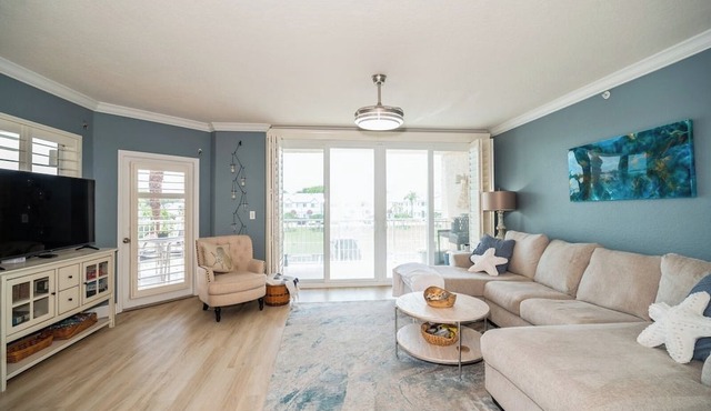 Coastal living meets luxury in this 3-bed, 2-bath oasis in an oceanfront complex