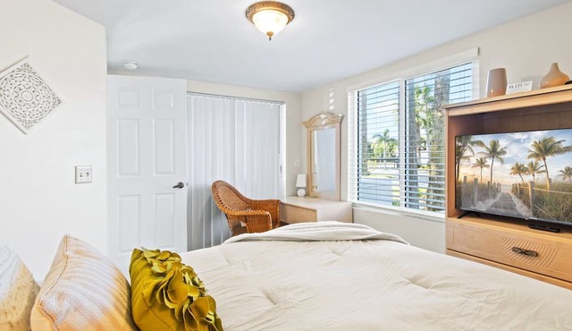 Sunlit Ground‑Floor Corner Condo ☀️ Private Patio, Steps to Beach & Pool!